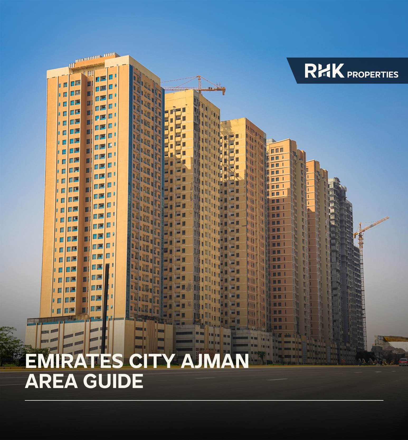 Emirates City Ajman skyline with apartment buildings and cranes