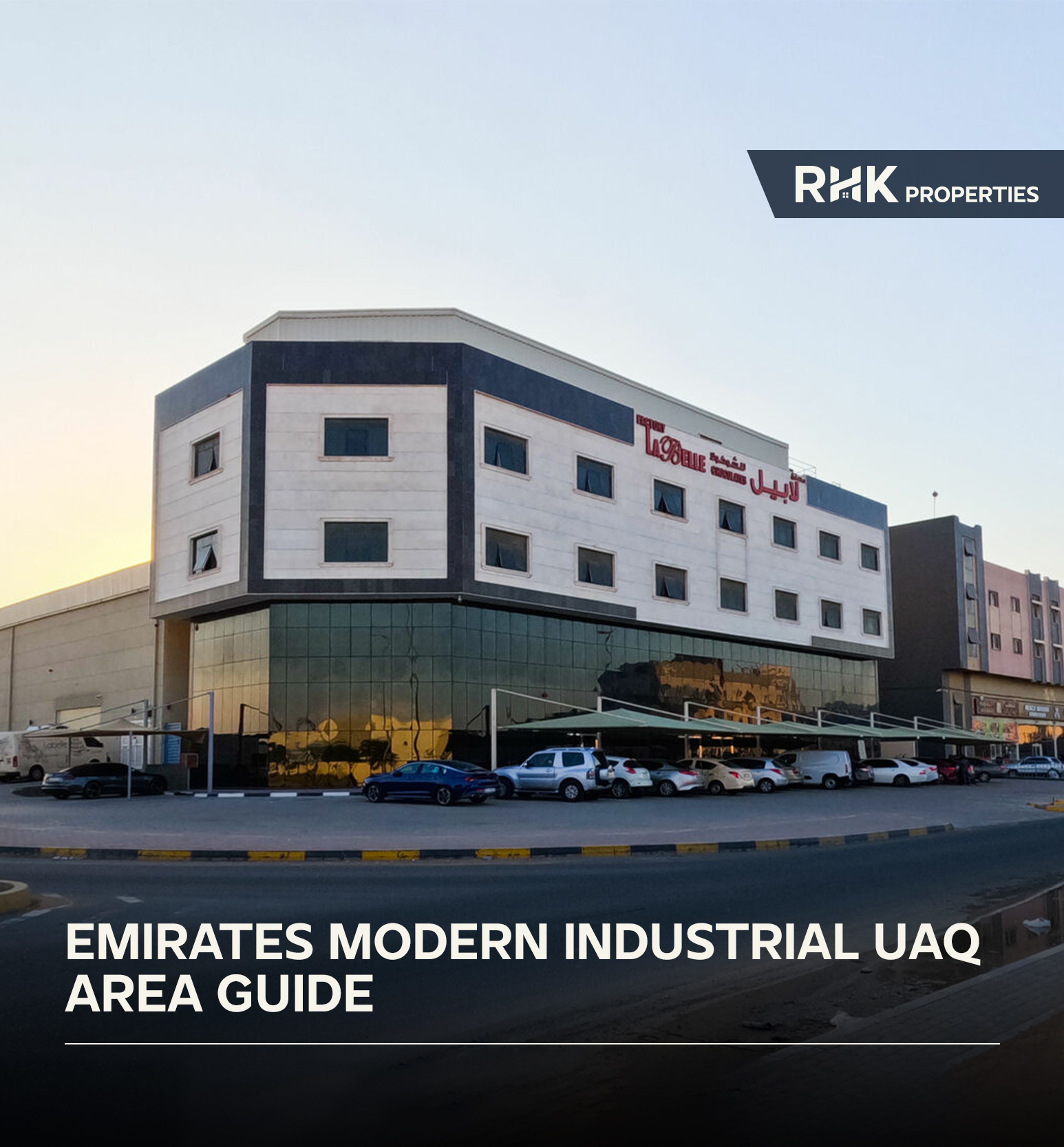 Emirates Modern Industrial Area UAQ with roadside shops and parked vehicles