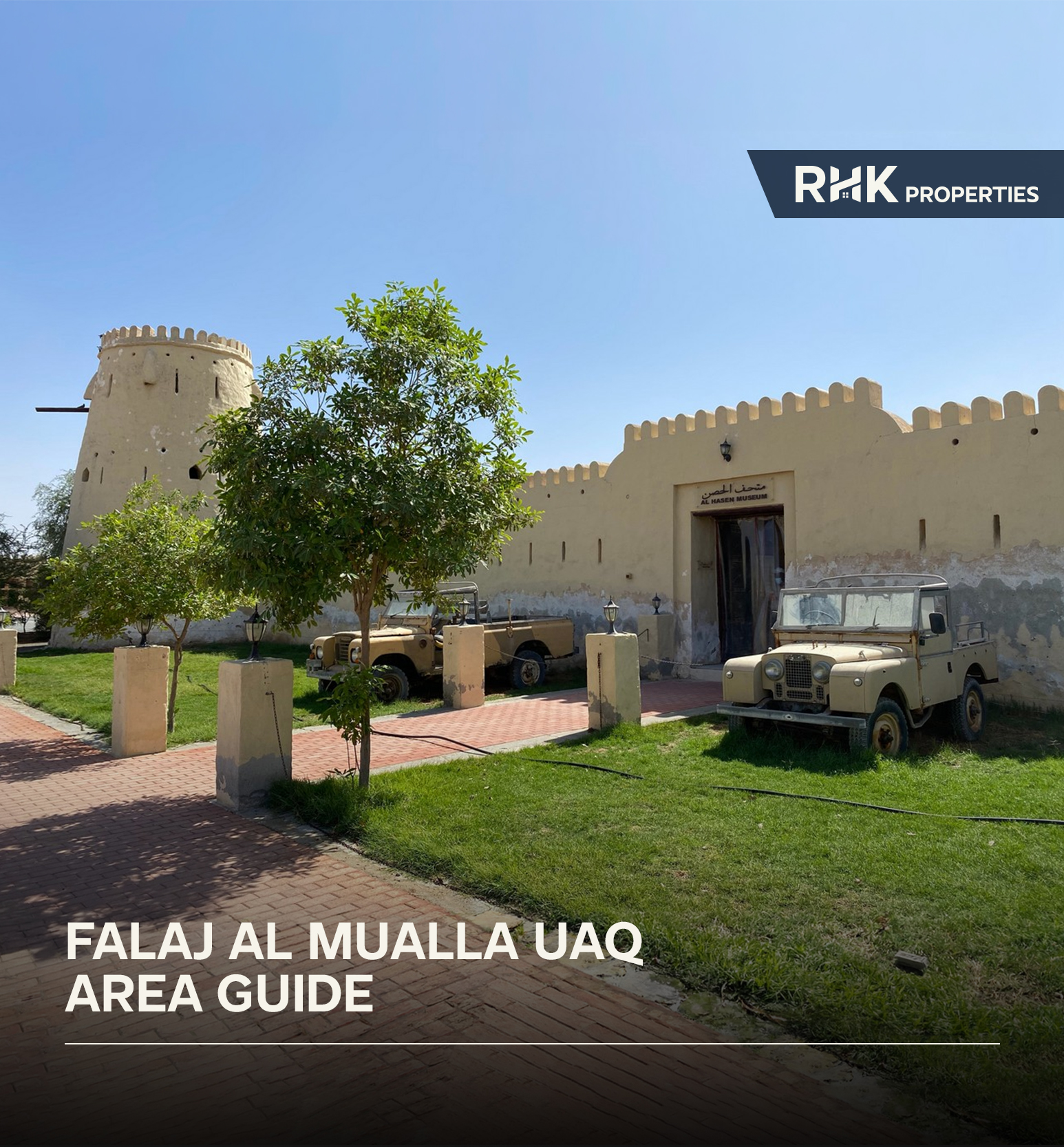 Historic Al Hasen Museum building with vintage vehicles in UAQ