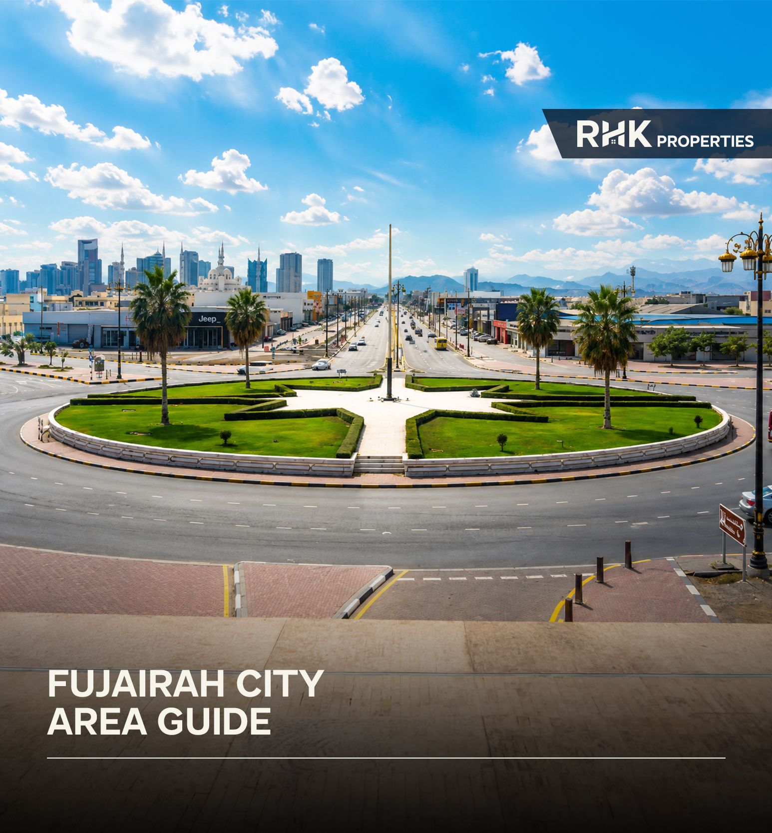Central roundabout with palm trees and mountain views in Fujairah City