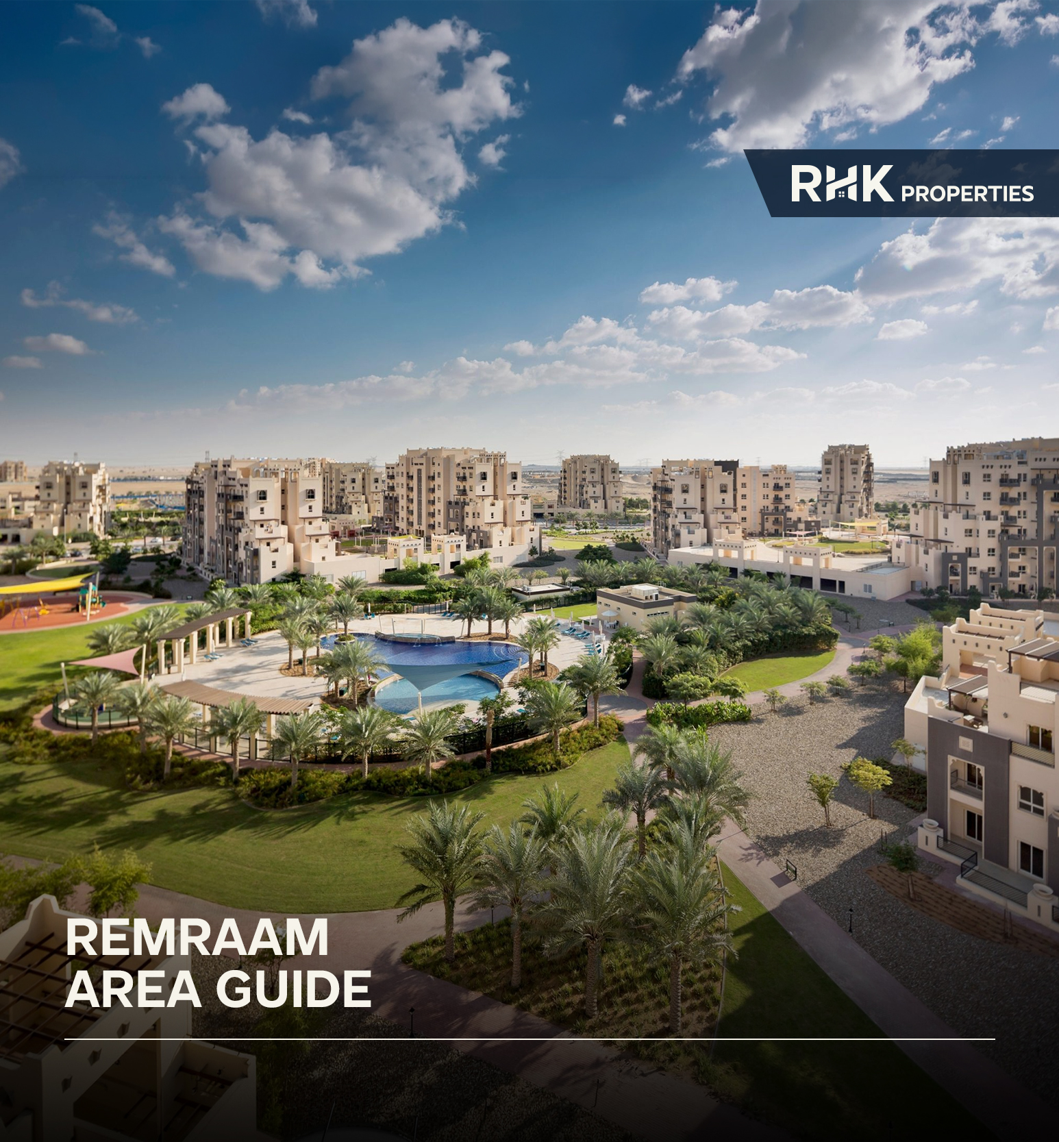 Aerial view of Remraam Dubai featuring low-rise residential buildings, swimming pools, palm-lined pathways, and green open spaces.