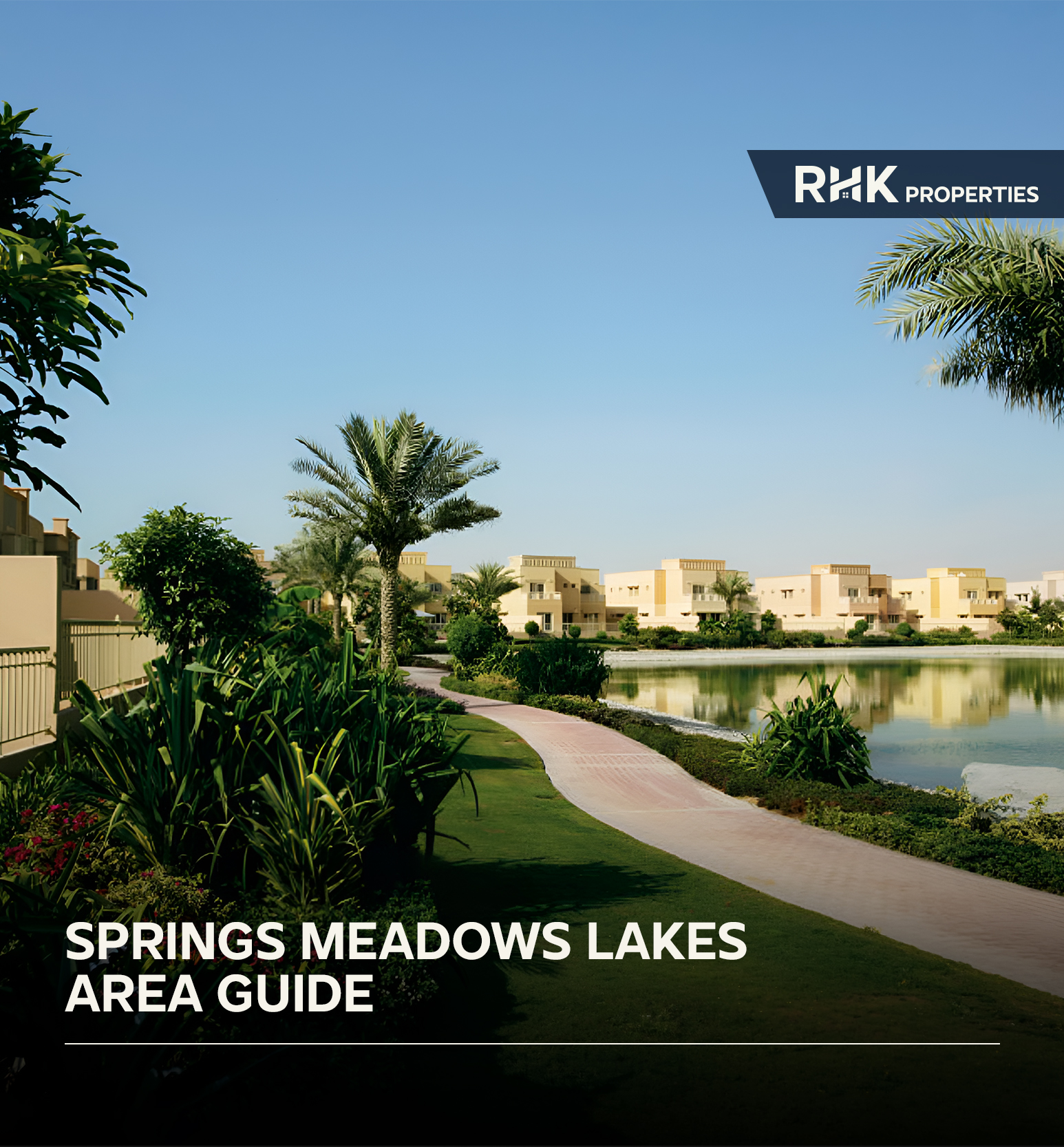 Scenic walking path beside a lake in Emirates Living with lush greenery and villas across The Springs, Meadows, and Lakes communities.